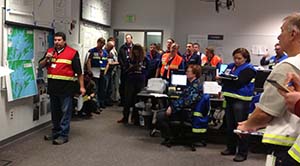 Response personnel gather to hear an update on the drill's progress. Photo by Amanda Johnson.