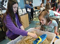 At the Homer oil spill Discovery Lab, students demonstrate the effects of wind on oil distribution.