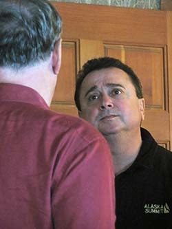 Mayor Tim Kerner of Jean Lafitte, Louisiana, listens as Devens talks about his experiences. Below, Devens speaks with other Louisiana leaders he invited to his home in Valdez in 2010.