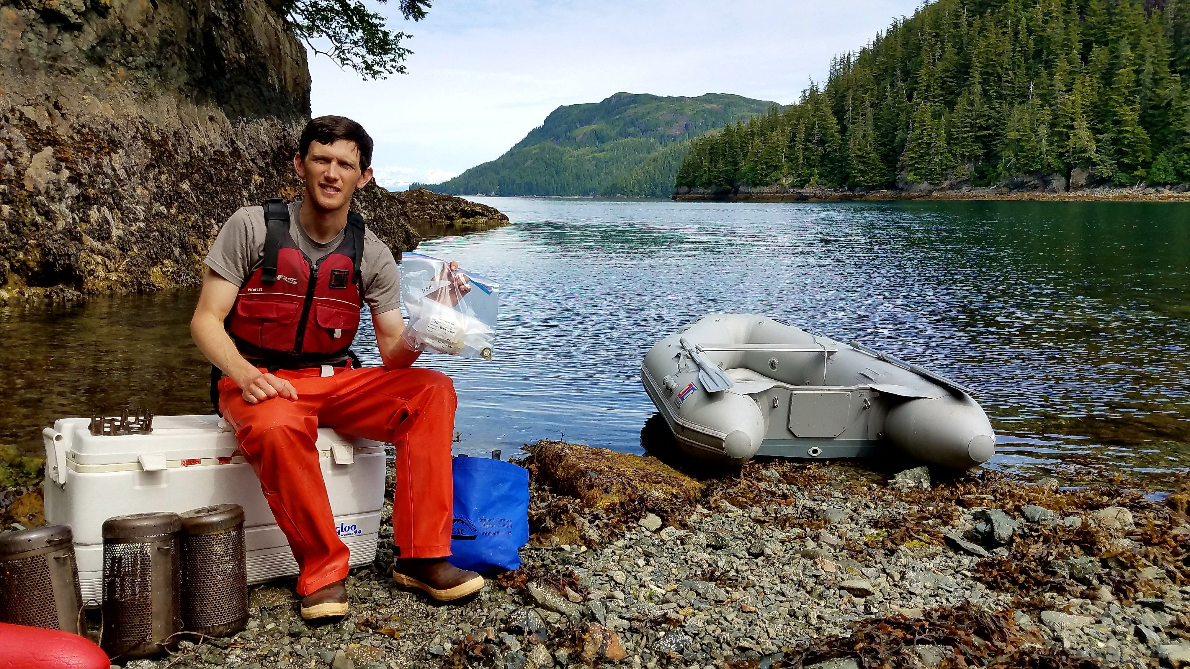 Photo of Austin Love conducting passive sampling for LTEMP project in 2018.
