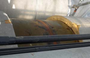 Girth weld in the crude oil piping to Berth 4. The weld is showing superficial amounts of corrosion that does not materially affect the integrity of the weld. The coating applied to the visible piping segment during construction appears to be in remarkably good condition. Photo by Tom Kuckertz.